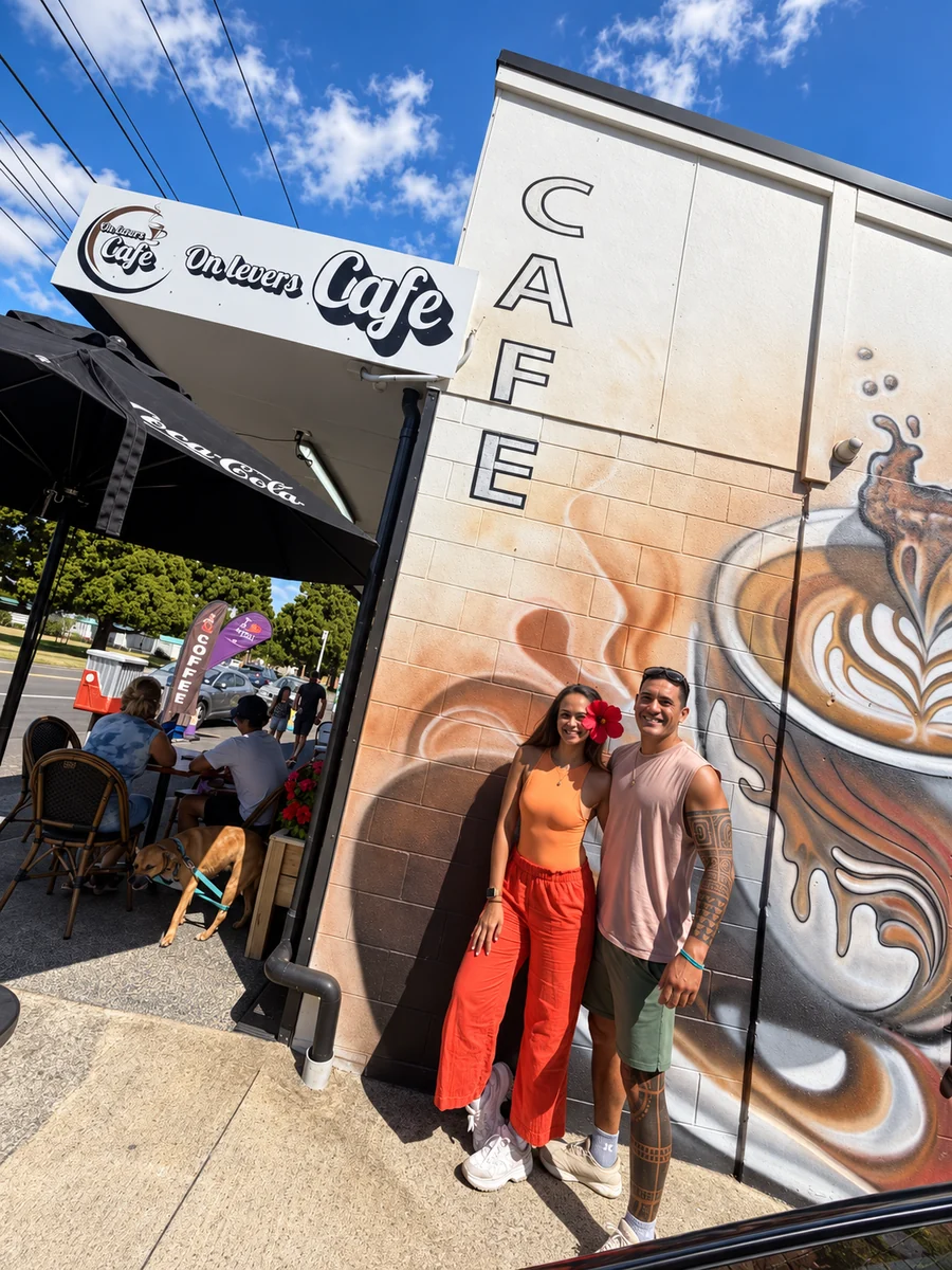 Guests outside the On Levers Cafe mural and entrance