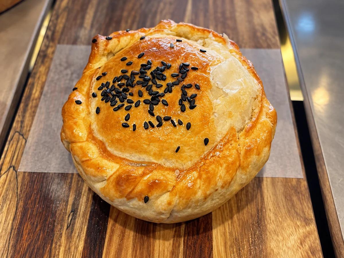 Golden savoury pie in the On Levers Cafe cabinet
